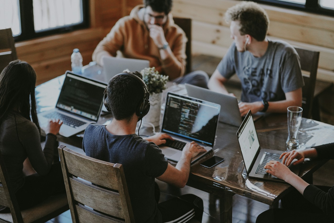 A small business team collaborating around a laptop